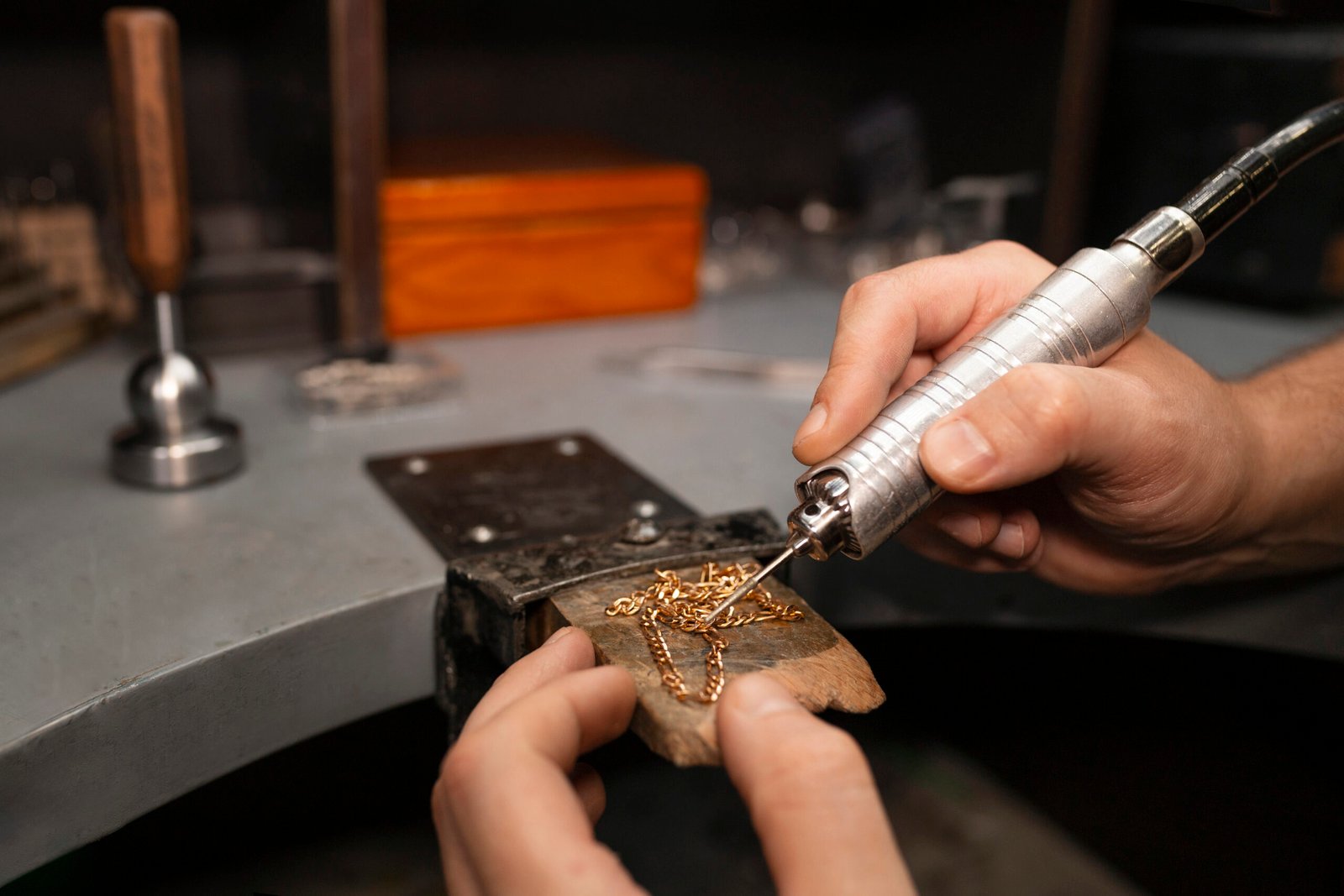jeweler s hands making jewellery scaled